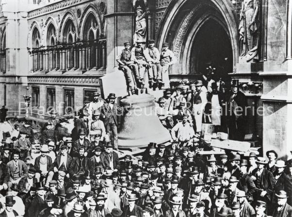 Workers fitting the minute bell, Bradford Town Hall